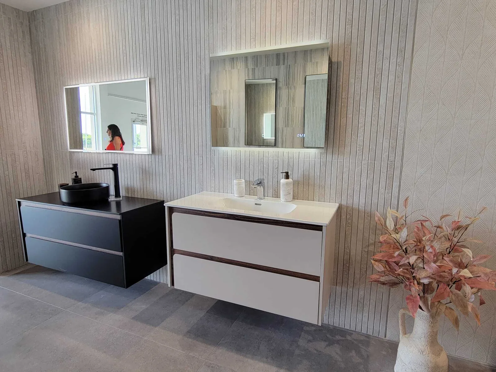 Master bathroom with dual floating vanities and LED-lit mirrors